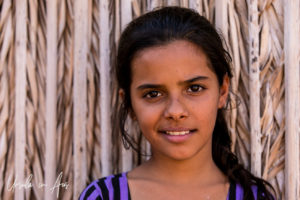 Portrait of a smiling Bedouin girl, Wahiba Sands, Oman