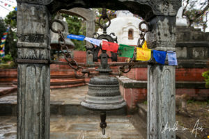 Prayer Flags and a large hanging bell, Swayambhunath, Kathmandu Valley Nepal