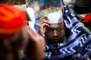 Western Highland man building his headdress, Papua New Guinea