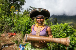 Young Enga woman in traditional costume with her drum, Western Highlands, Papua New Guinea