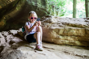 Young girl taking a selfie, Hocking Hills State Park, Ohio