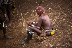 Hamar woman in leg-bells and traditional dress, Omo Valley Ethiopia