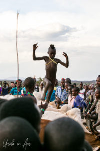 Young Hamar boy doing his cattle jumping, Omo Valley Ethiopia