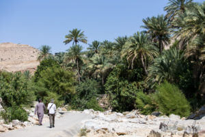 People walking into Wadi Bani Khalid, Oman