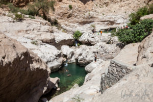 People swimming in rock pools, Wadi Bani Khalid, Oman