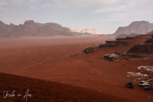 Hail on a red dune and the valley, Wadi Rum Jordan