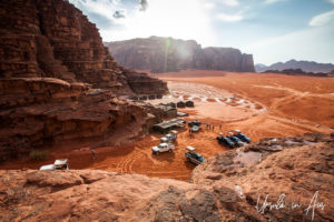 Vehicles parked on the Red Sands, Wadi Rum Jordan