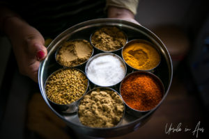 A Nepali spice tin with salt, turmeric, chilli , fenugreek, cumin, coriander, and ajwan.A Nepali spice tin with salt, turmeric, chilli , fenugreek, cumin, coriander, and ajwan.