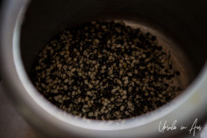 An iron pot of split black gram beans.
