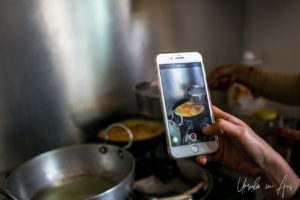 Filming a Nepali stovetop on a phone.