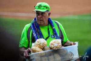 Portrait: Man with a basket of lpopcorn bags, Safeco, Seattle USA