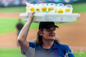 Portrait: Man with a tray of lemonaide drinks on a tray on his head, Safeco, Seattle USA