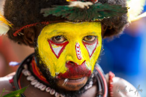 Portrait: Huli Wigman in face paint, Paiya Village, Papua New Guinea.