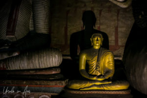 Small seated Buddha in the Cave of the Great Kings, Dambulla Cave Temple, Sri Lanka