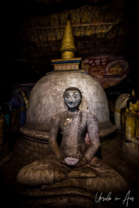 Seated Buddha on a stupa, Dambulla Cave Temple, Sri Lanka