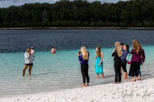 People standing in the waters of Lake Mckenzie, Fraser Island, Queensland Australia
