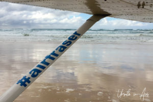 View of Seventy-Five Mile Beach, and an Air Fraser strut from inside the plane, Queensland Australia