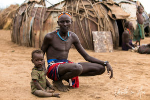 Young Daasanach Man and child, Omo Valley Ethiopia