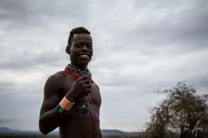 Portrait: Young Hamar man with a phone, Omo Valley Ethiopia