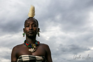 Portrait: Hamar man in a feathered headdress, Omo Valley Ethiopia