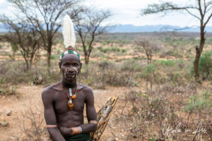 Portrait: Hamar man in a feathered headdress, Omo Valley Ethiopia