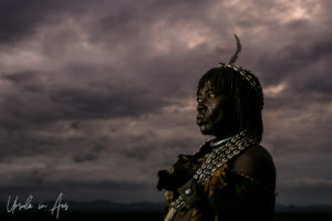 Portrait: Elder Hamar Woman against a dark sky, Omo Valley Ethiopia