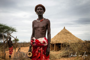 Hamar man with a wooden stool and a small-brimmed hat, Omo Valley Ethiopia