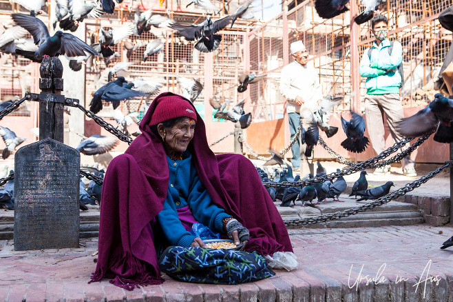 Old woman selling bird food, Durbar Square, Patan Nepal