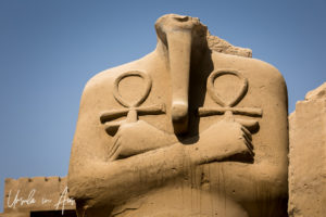 Headless torso of a pharaoh holding two anks, Karnak Egypt