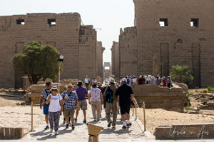 Tourists walking to and from the First Pylon, Karnak Egypt