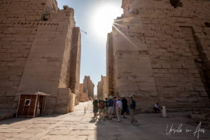 Tourists walking to and from the First Pylon, Karnak Egypt
