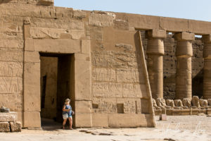 Tourist in the entry to the Barque Shrines of Seti II, Karnak Egypt