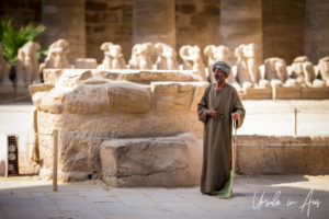 Man with a broom in the First Courtyard, Karnak Egypt