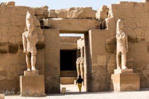 Tourist in a entry to a shrine, Karnak Egypt