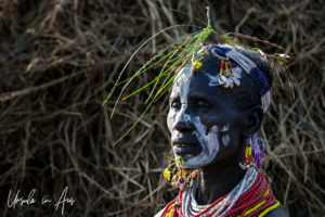 Portrait: Kara woman in face paint and flowers, Dus Village, SNNPR Ethiopia