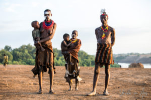Kara man, two women and babies, Dus Village, SNNPR Ethiopia