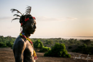 Portrait: Kara man in a beaded headband and feathered cap, Dus Village, SNNPR Ethiopia