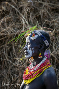 Portrait: Kara woman in face paint and flowers, Dus Village, SNNPR Ethiopia