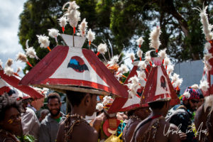 Papuan Islanders in triangular red and white hats, Mt Hagen, Papua New Guinea