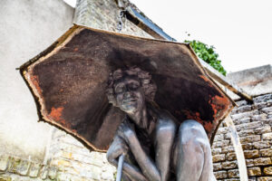 Enfant sous un Parapluie sculpture, the Jardin du Tripot, Honfleur, France