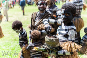 Young Simbu man making fire, Mt Hagen Papua New Guinea