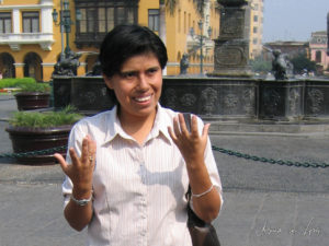 Smiling Peruvian woman in Plaza Mayor, Lima Peru