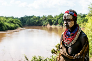 Woman in guinea fowl face paint, Omo River Ethiopia