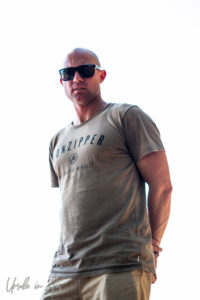 Portrait: Ben McRae against a white sky, Omo Valley Ethiopia