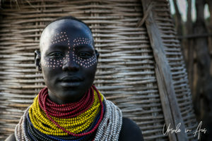 Portrait: Kara woman with dots around her eyes, Omo River Ethiopia