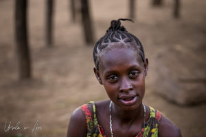 Portrait: young Kara woman with braided hair, Dus Village Ethiopia