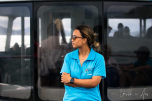 Young woman in a Dive Team polo-shirt, Cruise Whitsunday catamaran, Australia