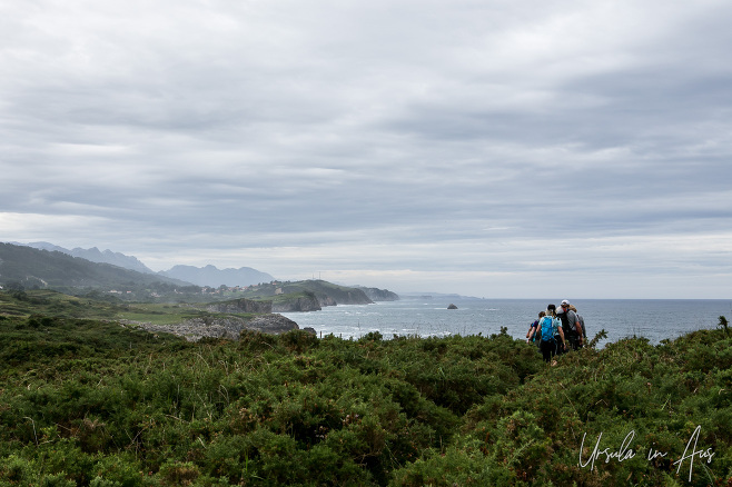 Walkers on the dramatic cliffs of Asturias Spain