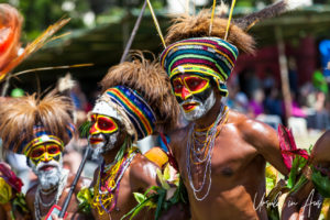 Portrait: Western Highland Man in face paint and multicoloured hat, Mt Hagen Cultural Show, PNG