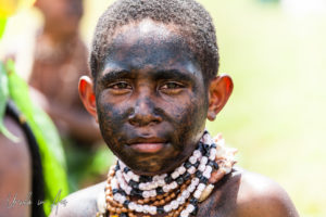 Portrait: Child from the Ekawest Culture Group, Mt Hagen Cultural Show, PNG